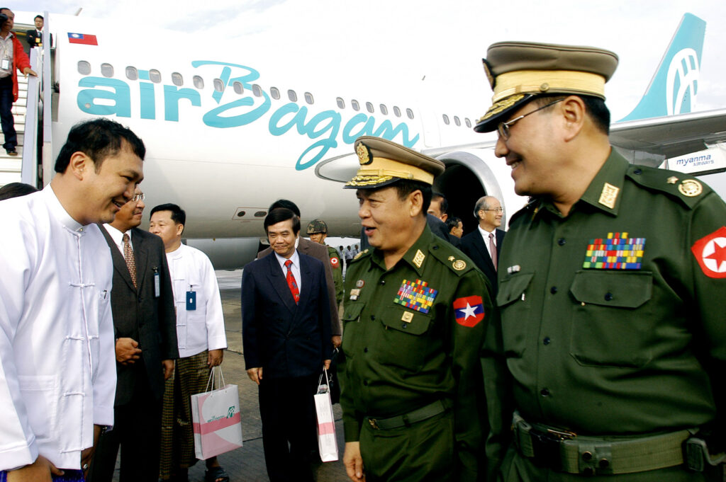 Tay Za, left, with Myanmar military officers at ceremony marking Air Bagan’s first international flight, at Yangon International Airport in 2007.Source AP Photo