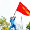 သမဂ္ဂအလံနှင့်ကဗျာဆရာ ​ကေဇဝင်း။ဓါတ်ပုံ-​ကေဇဝင်း​ဖေစ်ဘွခ်