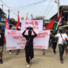 (ကချင်ပြည်နယ် ဖားကန့်တွင် ၂၀၂၁ မေလ ၂ ရက် ပစ်ခတ်မှုမဖြစ်ပွားခင် တွေ့ရသည့် အာဏာသိမ်းမှုဆန့်ကျင်ဆန္ဒပြသူများ။ ဓာတ်ပုံ - CJ)