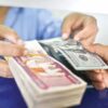(အ​မေရီကန် အစိုးရက စစ်​ကောင်စီ ဘဏ် ၂ ​ခုအ​ပေါ် အ​ရေးယူဒဏ်ခတ်လိုင်​သောဂယက်​ကြောင့် ဒေါ်လာဈေးတက်လာသည်ကို စစ်အုပ်စုက လုပ်ငန်းရှင်များကို လွှဲချကာဖမ်းဆီး​နေခြင်းဖြစ်သည်။ ဓါတ်ပုံ-WSJ)
