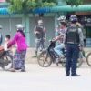 (ပြီးခဲ့သည့်နှစ်အတွင်းက မိတ္ထီလာမြို့တွင် ဆိုင်ကယ်စီးနင်းသူများအား စစ်ကောင်စီတပ်ဖွဲ့ဝင်များက စစ်ဆေးနေစဥ်။ ဓာတ်ပုံ - Cj)