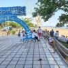 (​ကျောက်ဖြူ မြို့အဝင်ဆိုင်းဘုတ် နှင့် ၂၀၂၁ ​မေလတွင် အမှိုက်​ကောက်ပြီး ခတ္တအနားယူ​နေသူများကို​တွေ့ရစဥ်။ဓါတ်ပုံ- CJ)